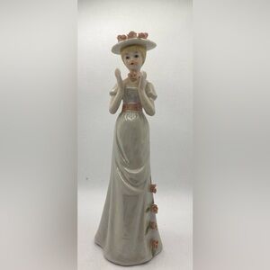 Elegant Porcelain Lady Figurine with Pink Accents Approximately 8”T